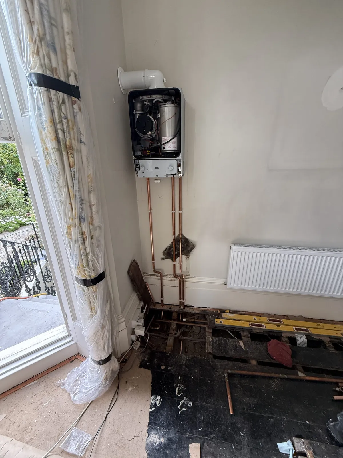 New copper pipework run to a boiler during a domestic plumbing installation