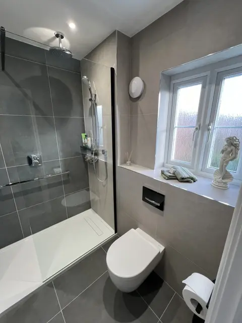 Beige Walk-In Shower with Matt Black Rail
